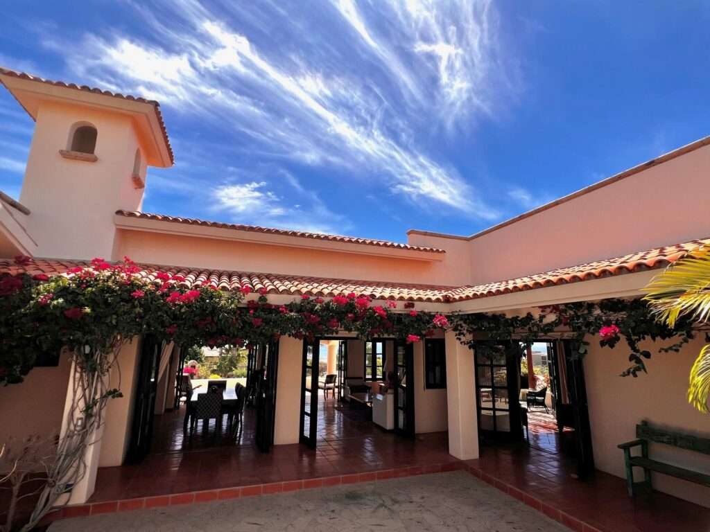 San Jose del Cabo La Noria One of the first homes built in La Noria, within the amenity rich development of Puerto Los Cabos, this very unique two bedroom, two bath home, followed the Hacienda style's original design guidelines, with a large entry courtyard, rooms to the sides and opening to the main living area, kitchen and outdoor patio/deck.The initial concept and plans were designed with a third bedroom in mind, to be built at a different time, yet the functionality of the two bedroom house ended up suiting its owners well and thus house did not grow within the still remaining buildable area of the homesite.Subsequently, a second design concept was planned, to build a second level master bedroom with panoramic – Ave Mision San Diego, San Jose del Cabo, BS